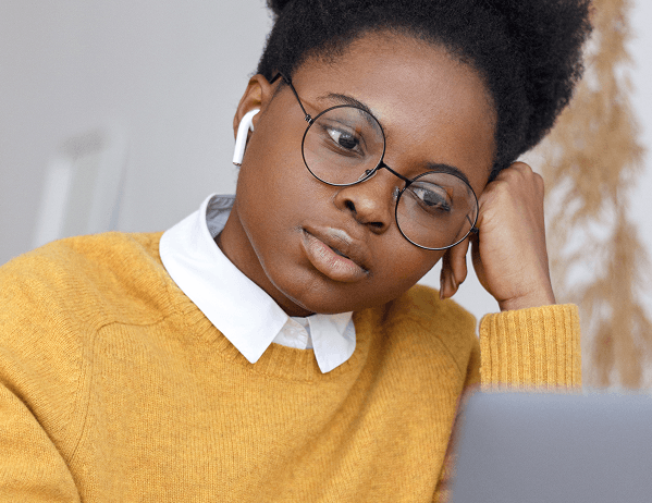Professional exploring online courses on a laptop